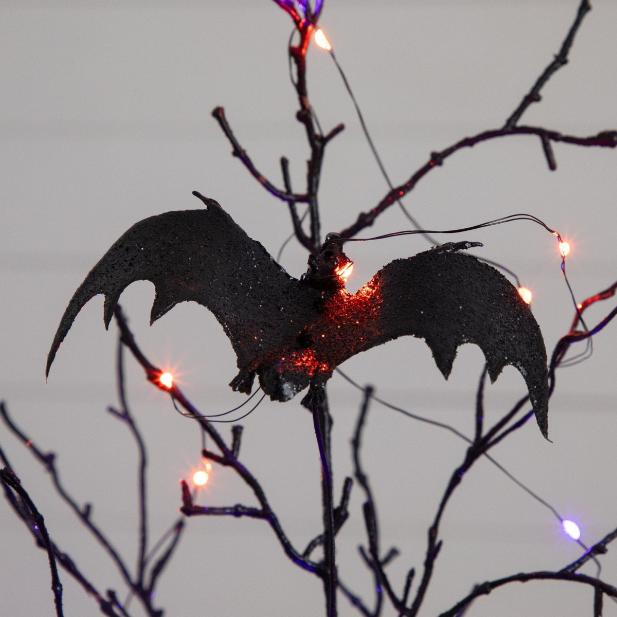2' Pre-Lit Artificial Black Spooky Twig Tree with Bats and 40 Orange & Purple LED Lights - Che Cose Belle