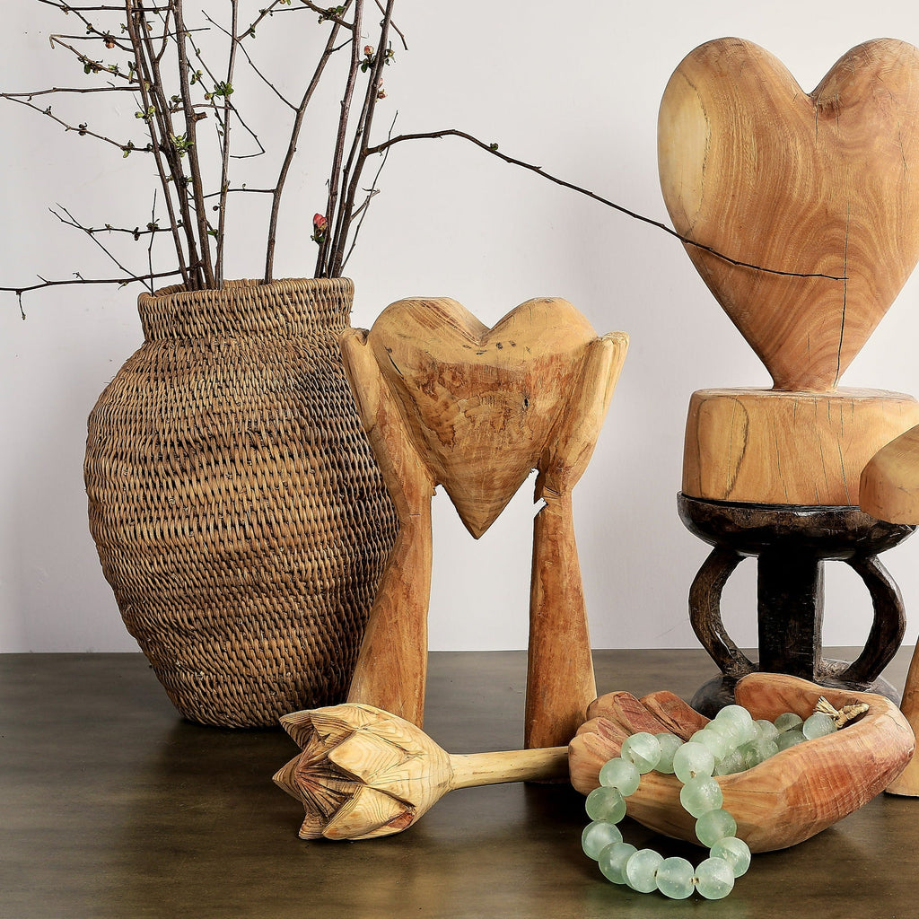 Hands Holding Heart Sculpture