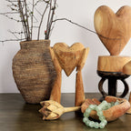 Hands Holding Heart Sculpture