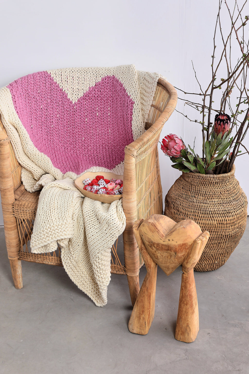 Hands Holding Heart Sculpture