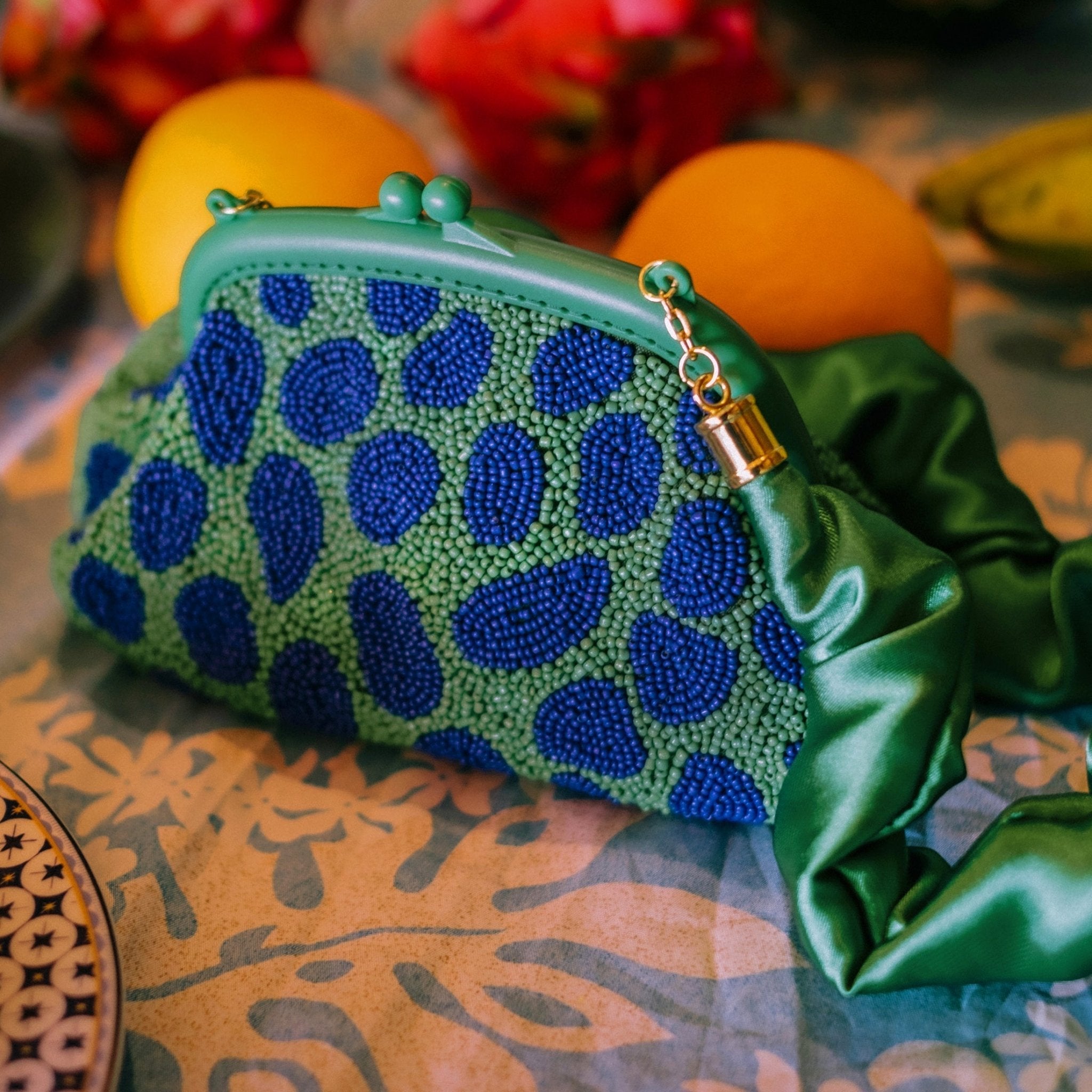 the Arnoldi Jade Clutch Bag In Lush Green & Blue - Che Cose Belle